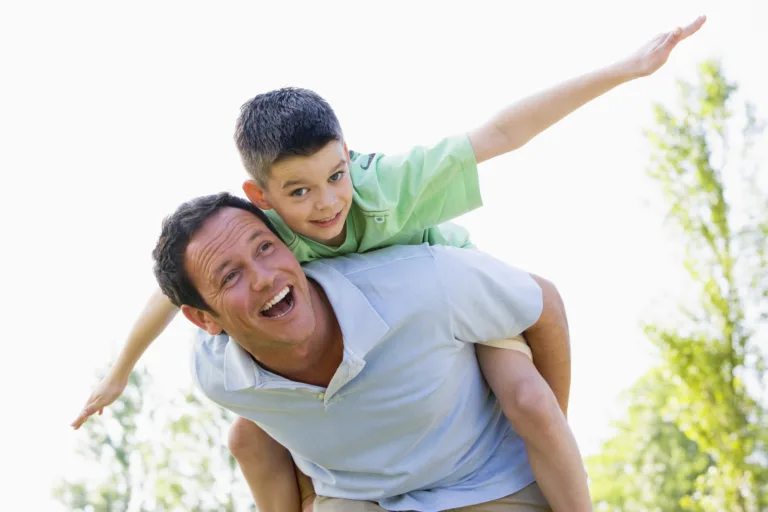 bigstock Man Giving Young Boy Piggyback 4133443 dad 8 yr old boy माझे बाबा